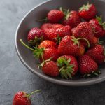 strawberries on white ceramic bowl