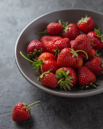 strawberries on white ceramic bowl