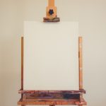 brown wooden table with white wall