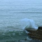 brown rock formation on sea during daytime