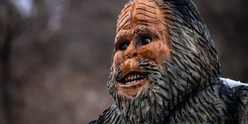 a close up of a statue of a man with a beard