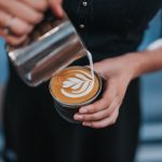 person holding coffee with latte cup