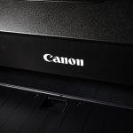 a canon printer with the word canon on it