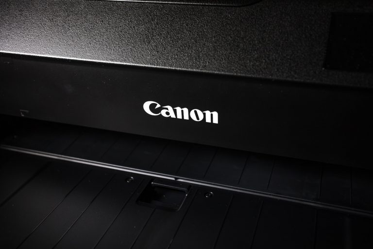 a canon printer with the word canon on it