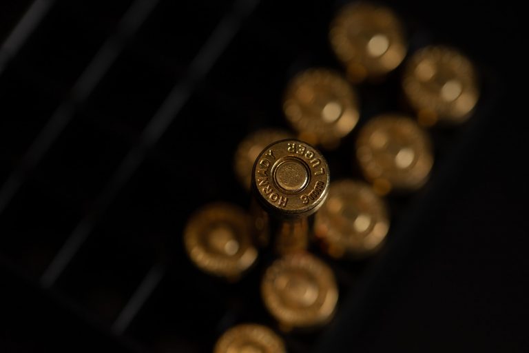 gold round coins on black surface