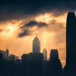 silhouette photography of high-rise buildings during golden hour