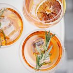 four glass cups on white surface