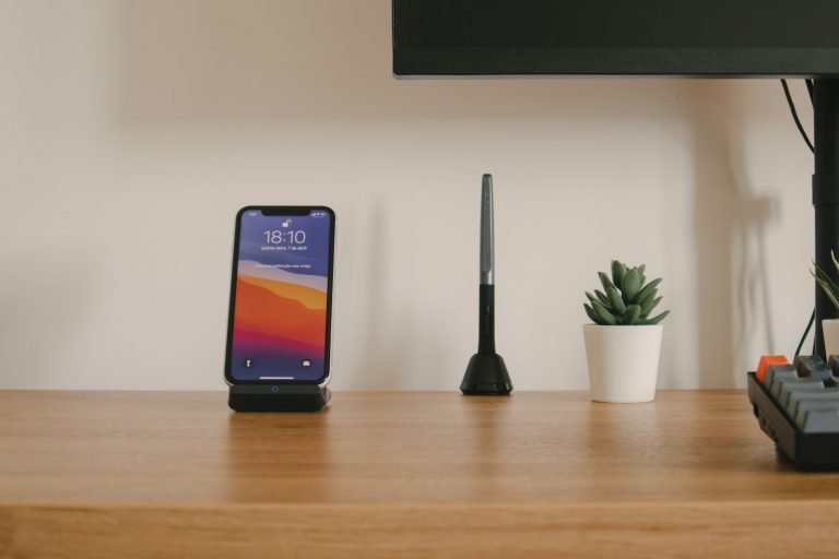 black samsung galaxy smartphone on brown wooden table