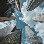 low angle photography of high rise buildings under blue sky during daytime