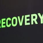 a close up of a sign that reads recovery