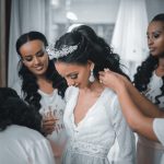 woman in white lace dress smiling