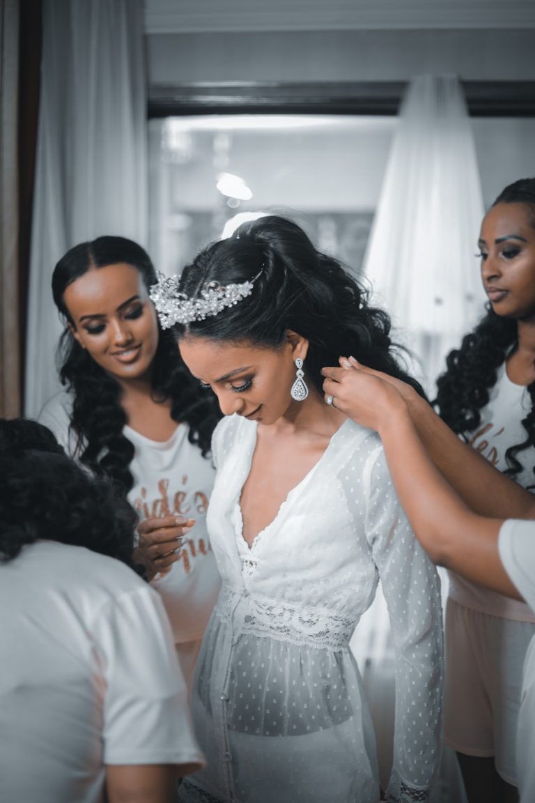 woman in white lace dress smiling