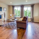 a living room filled with furniture and a fire place