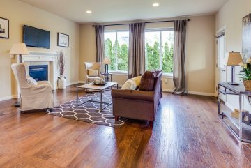 a living room filled with furniture and a fire place