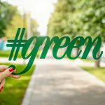 person holding green signage