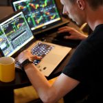 man sitting in front of the laptop