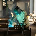 a welder working on a piece of metal