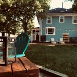 blue and brown wooden house near green trees during daytime