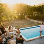 people sitting on chairs near pool