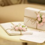 two pink and white floral boxes