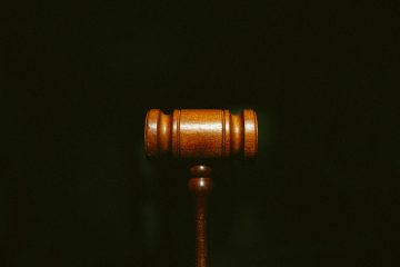 brown wooden stand with black background