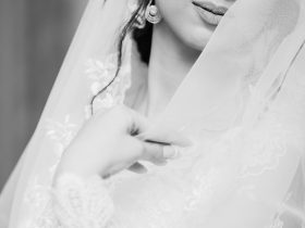 woman in white wedding dress closing eyes