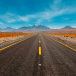 lone road going to mountains