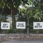 don't give up. You are not alone, you matter signage on metal fence