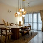 a dining room with a table and chairs