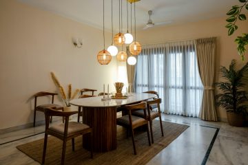 a dining room with a table and chairs