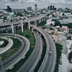 an aerial view of a highway in a city