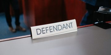 a desk with a sign on it that says defend