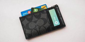 a wallet with credit cards sticking out of it