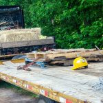 yellow and black heavy equipment on brown wooden pallet