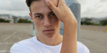 men's white crew-neck top close-up photography