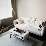 white couch in front of white wooden table