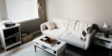 white couch in front of white wooden table