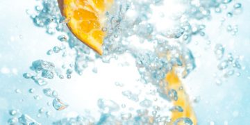 sliced orange fruits underwater