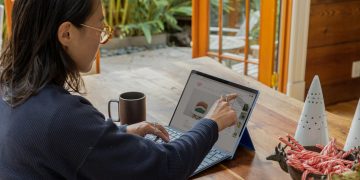 a woman using a laptop