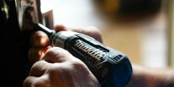 selective focus photography blue and black Makita power drill