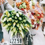 bouquet of flowers on bicycle