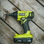 green and black cordless hand drill