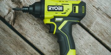 green and black cordless hand drill