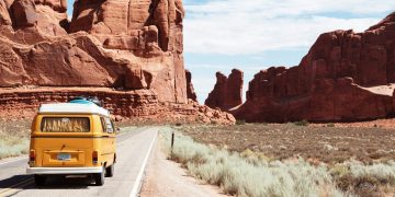 yellow Volkswagen van on road